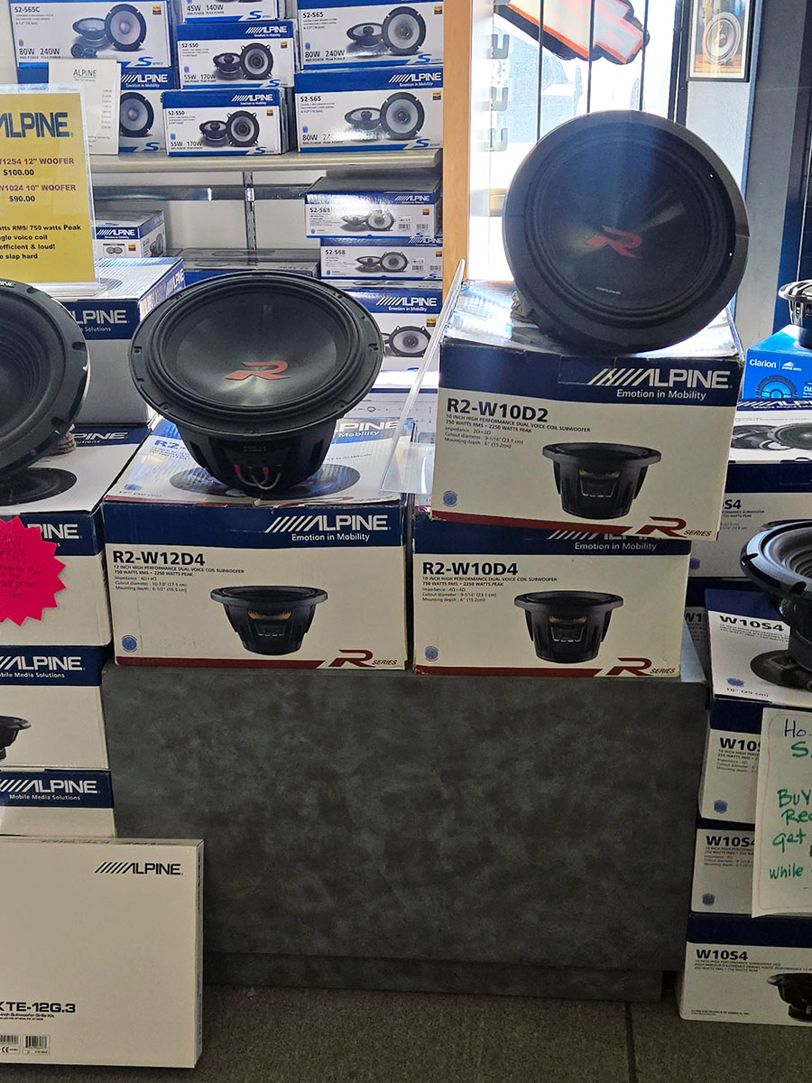 Alpine R-Series R2-W12D4 and R2-W10D4 subwoofers on display at Sounds Good To Me in Tempe, Arizona