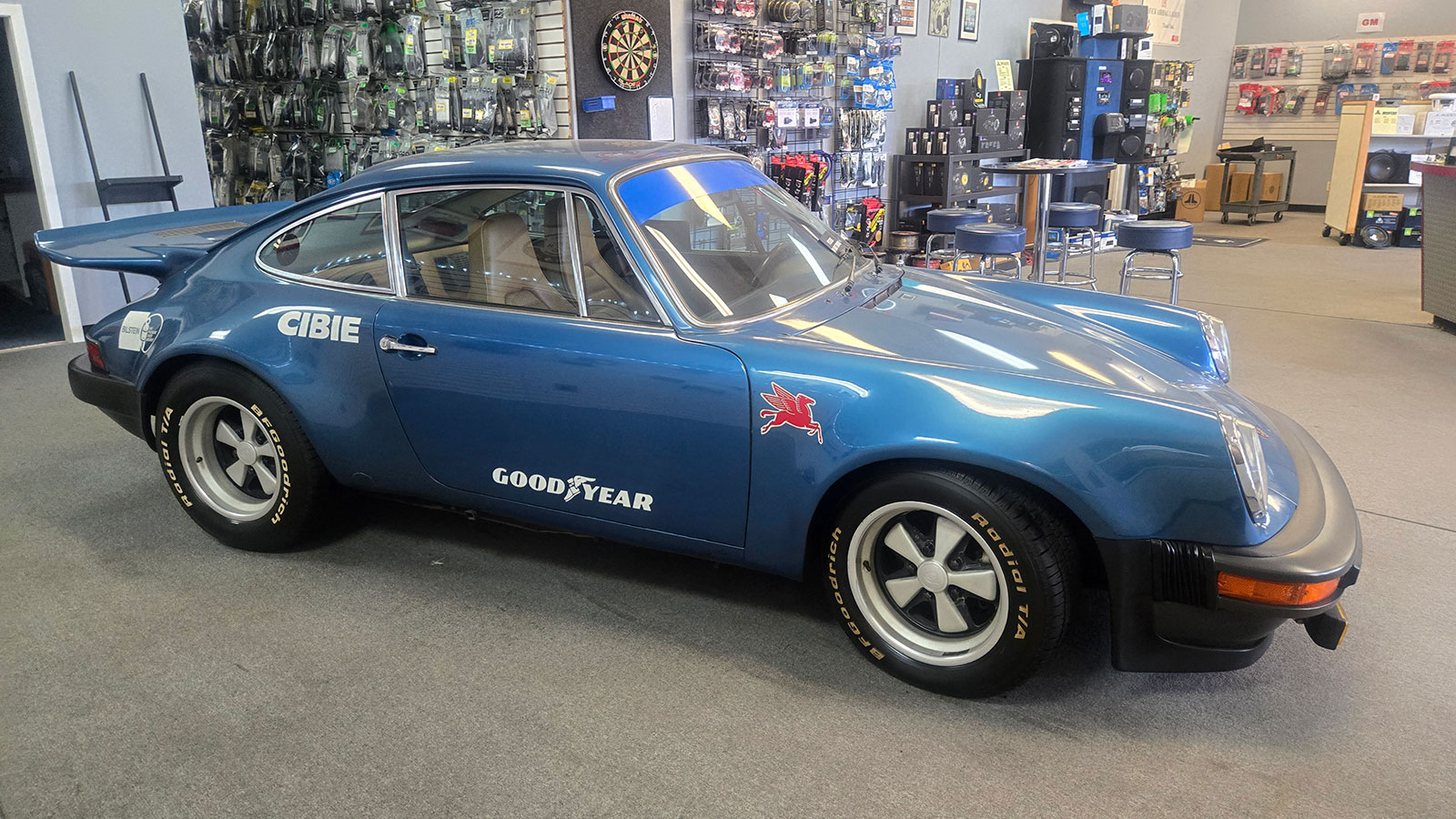 classic Porsche in car audio installation shop in Tempe AZ with aftermarket audio and electronics display