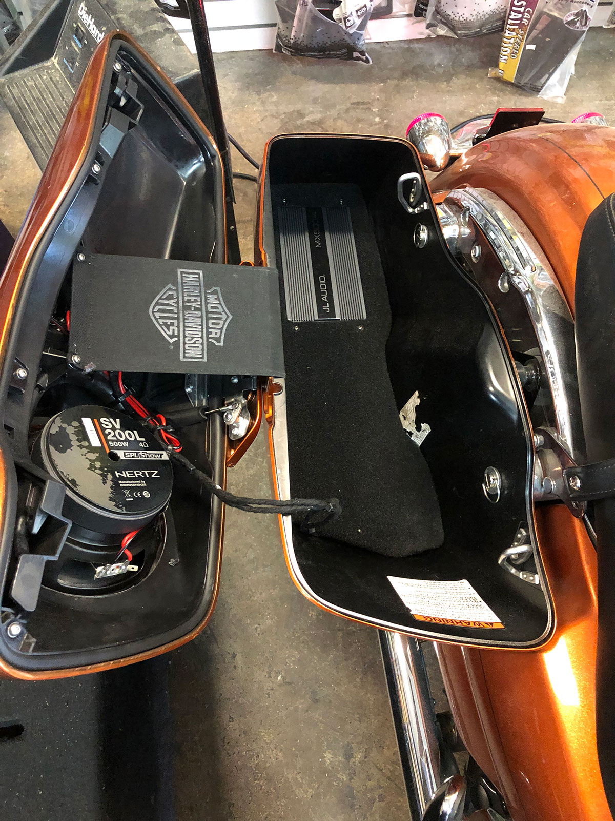 Hertz subwoofer and JL Audio amplifier installed inside Harley bagger saddlebag in Tempe AZ Hertz subwoofer and JL Audio amplifier installed inside Harley bagger saddlebag in Tempe AZ