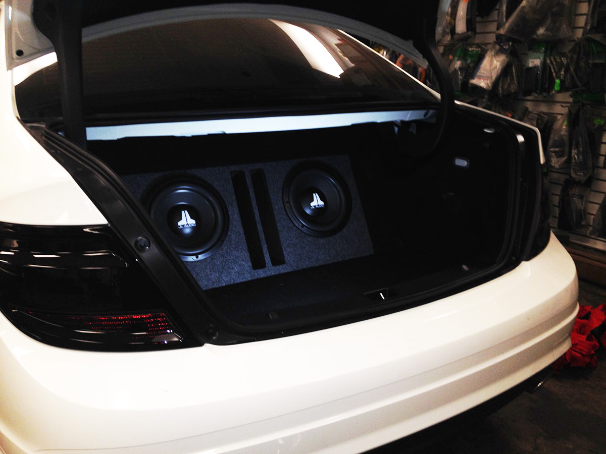Wide view of Mercedes C300 trunk with custom JL Audio subwoofer installation in Tempe AZ