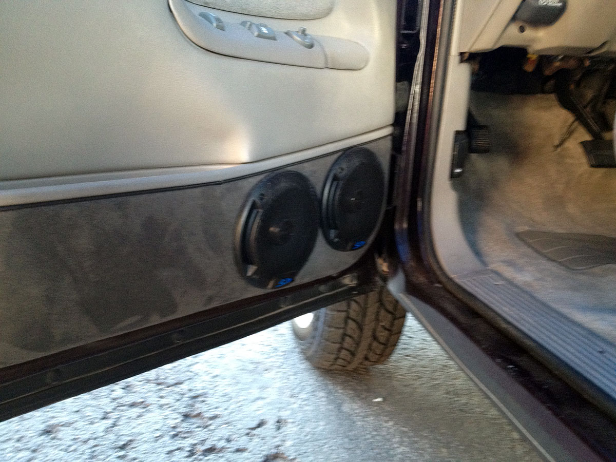 dual speakers installed in SUV door panel during car audio installation dual speakers installed in SUV door panel during car audio installation