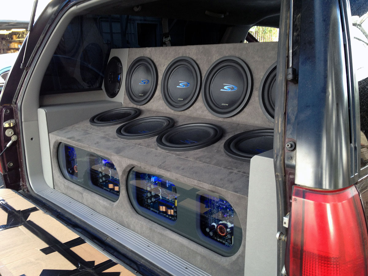 SUV audio system with multiple subwoofers and enclosure installed in rear interior SUV audio system with multiple subwoofers and enclosure installed in rear interior